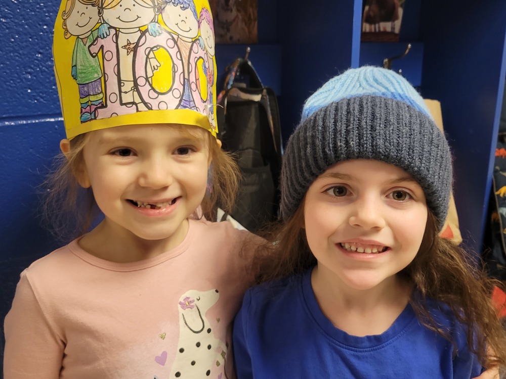 Two girls wearing hats
