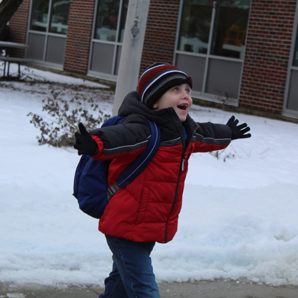 student excitedly holding hands open